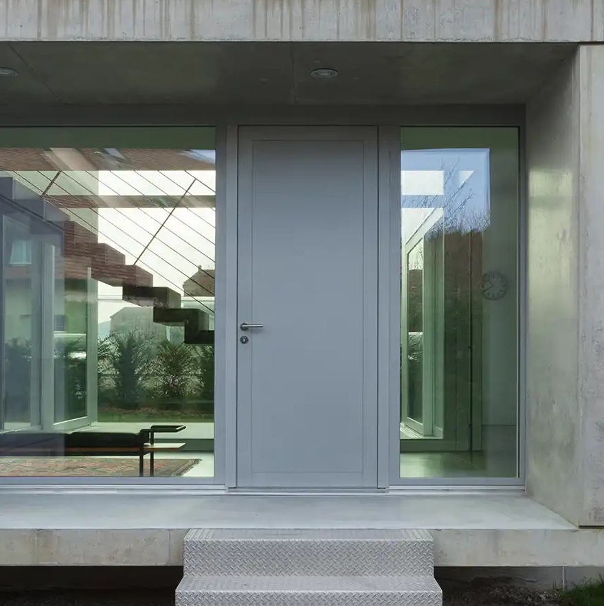 Collection of four insulated travel bottles on wooden shelf.